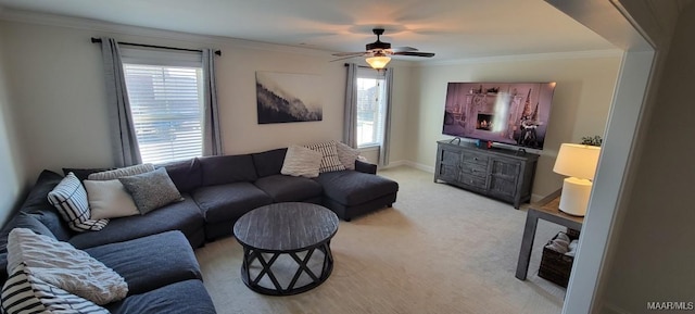 living room with crown molding, light carpet, and ceiling fan