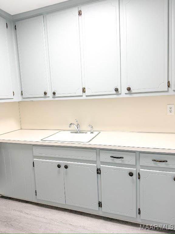 kitchen with sink and light wood-type flooring