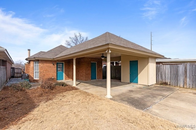 rear view of house featuring a patio, central AC, and ceiling fan