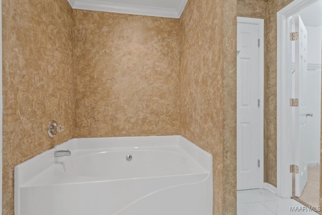 bathroom featuring a washtub and crown molding