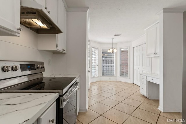 kitchen with pendant lighting, stainless steel range with electric stovetop, white cabinetry, ornamental molding, and light stone countertops