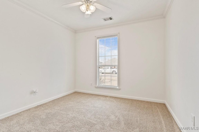 unfurnished room with crown molding, ceiling fan, and carpet flooring