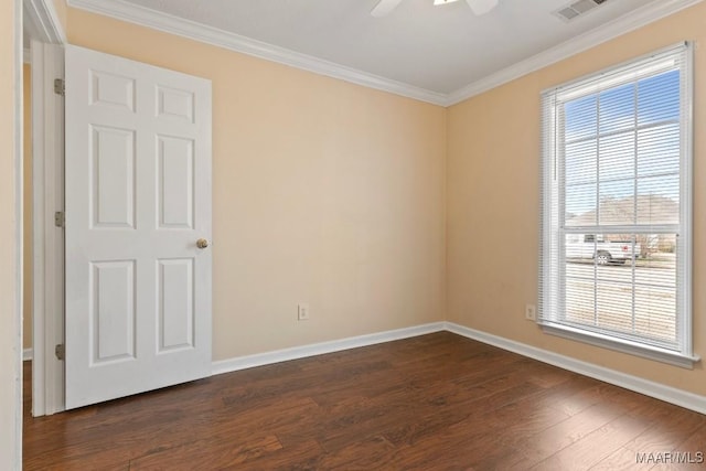 unfurnished room featuring dark wood-type flooring, ornamental molding, and ceiling fan