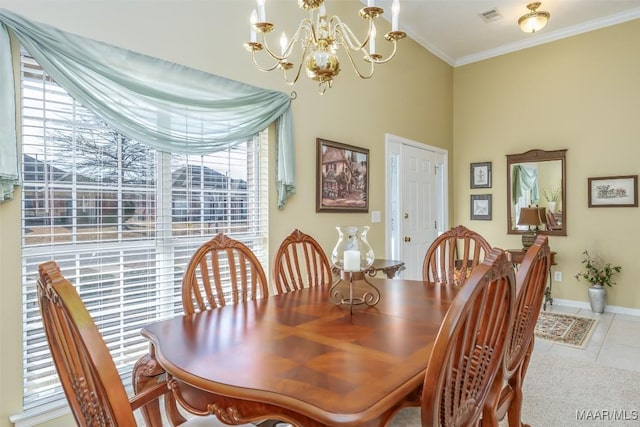 dining room with crown molding, an inviting chandelier, and light tile patterned floors