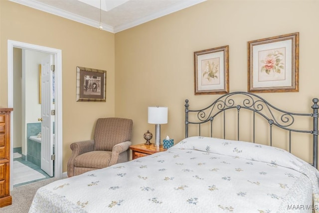 bedroom featuring crown molding, ensuite bath, and carpet floors