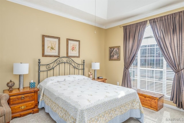 carpeted bedroom featuring crown molding