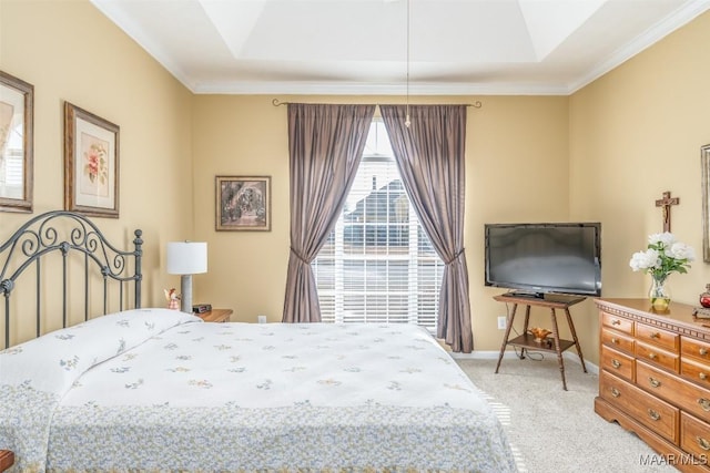 bedroom featuring crown molding, light colored carpet, and a tray ceiling