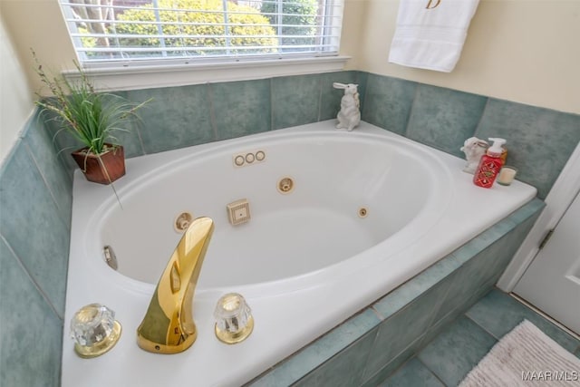 bathroom with a relaxing tiled tub