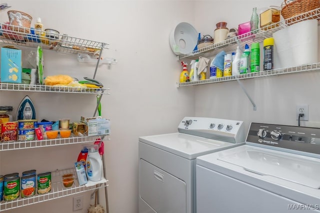 laundry area with washing machine and clothes dryer