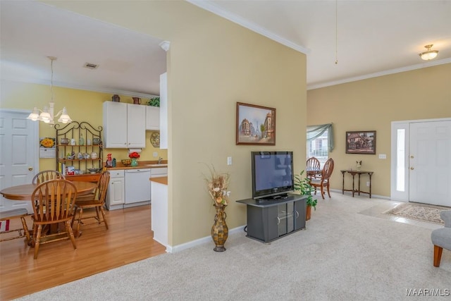 living room with ornamental molding and light colored carpet