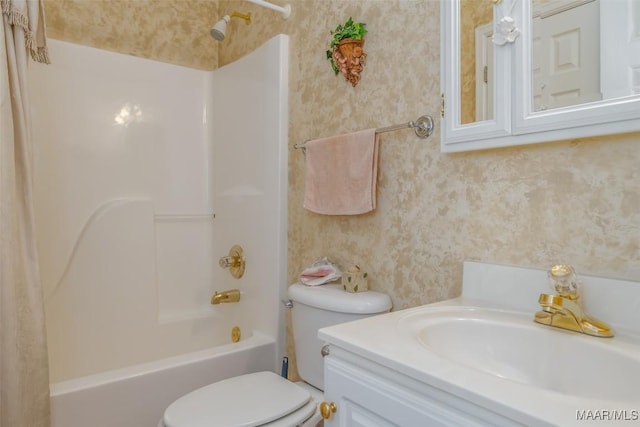 full bathroom with vanity, toilet, and washtub / shower combination