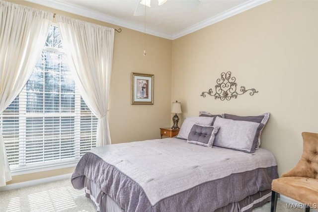 bedroom with multiple windows, ornamental molding, carpet flooring, and ceiling fan