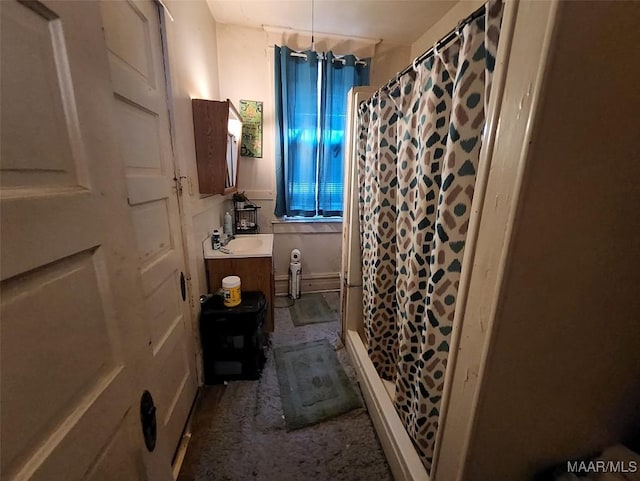 bathroom featuring vanity and a shower with shower curtain