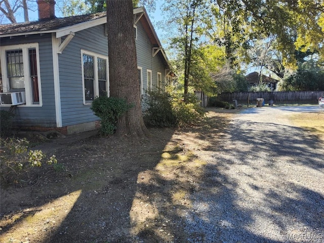 view of side of property featuring cooling unit