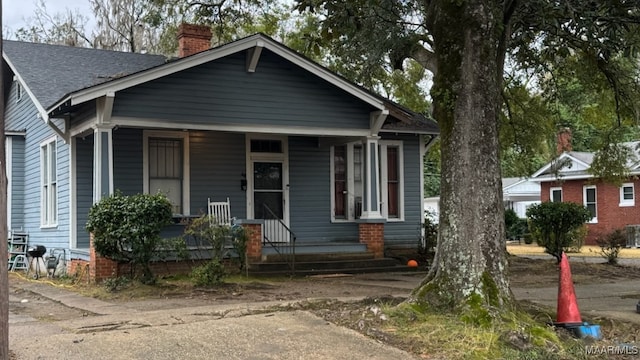 bungalow-style home featuring covered porch