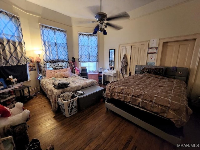 bedroom with ceiling fan and hardwood / wood-style floors