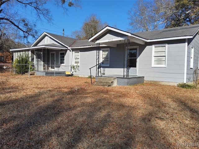 single story home with a porch