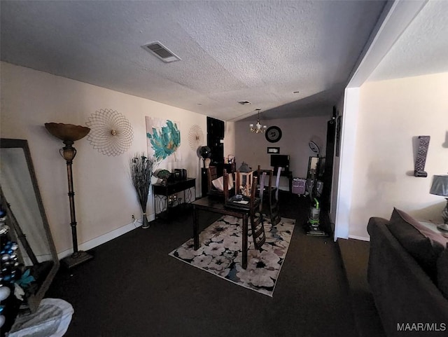 living room featuring an inviting chandelier, lofted ceiling, and a textured ceiling