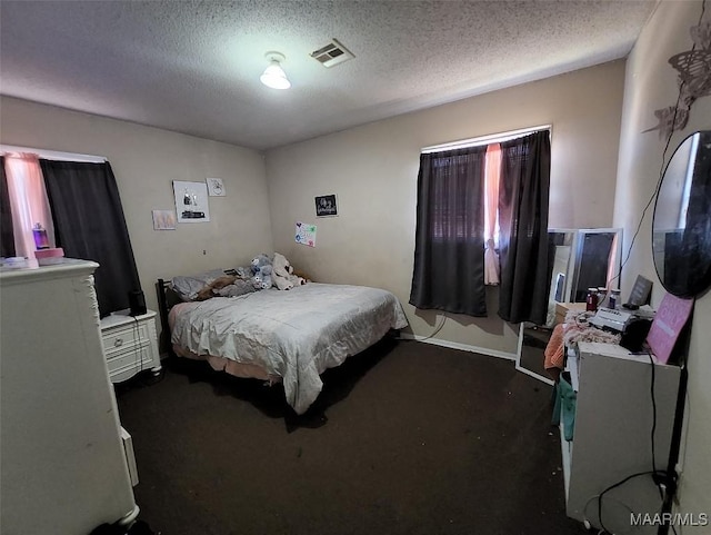 bedroom featuring a textured ceiling