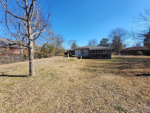 view of yard featuring a sunroom