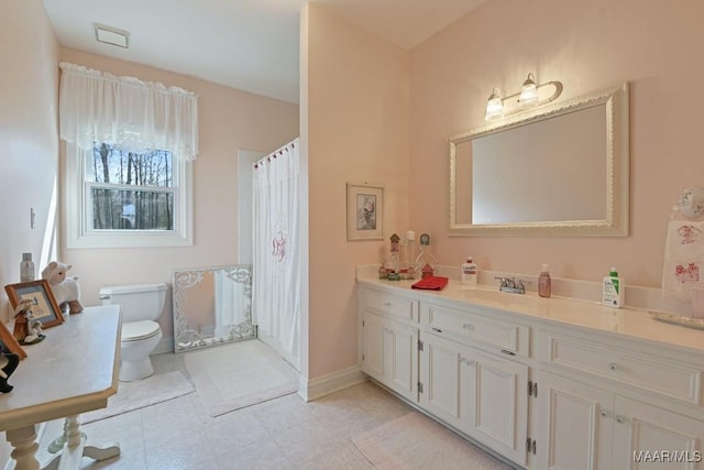 bathroom with vanity and toilet