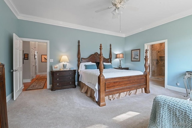 bedroom featuring ornamental molding, light colored carpet, ensuite bathroom, and ceiling fan