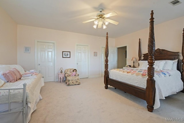 bedroom with light colored carpet and ceiling fan