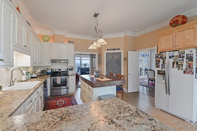 kitchen with white cabinetry, sink, pendant lighting, and stainless steel appliances