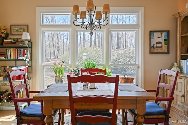 dining area featuring a notable chandelier and plenty of natural light