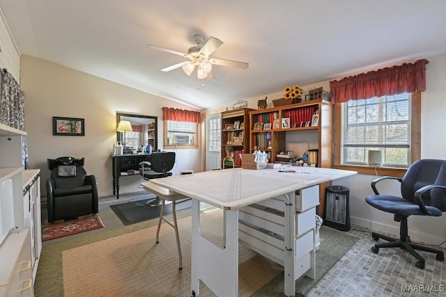 office with ceiling fan, vaulted ceiling, and light carpet