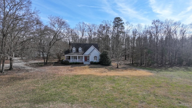 view of front of house with a porch and a front lawn