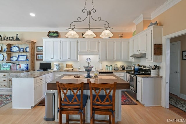 kitchen featuring white cabinetry, stainless steel electric stove, hanging light fixtures, and a kitchen island