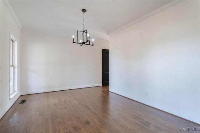 unfurnished dining area featuring wood-type flooring, a notable chandelier, and crown molding