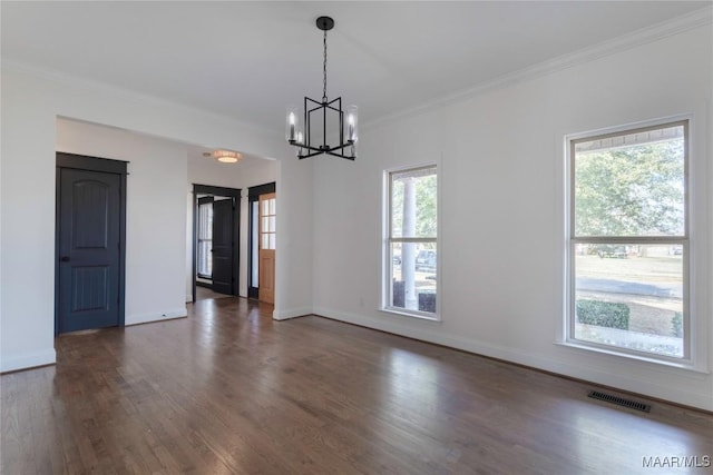 unfurnished dining area with crown molding, dark hardwood / wood-style flooring, and a notable chandelier