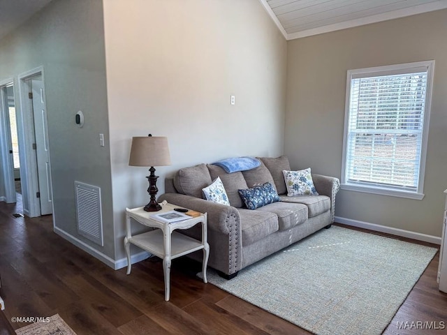 living room with ornamental molding and dark hardwood / wood-style floors