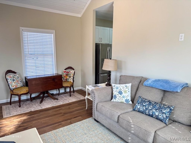 living room with ornamental molding and wood-type flooring