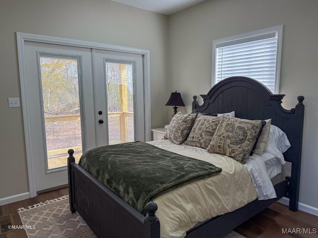 bedroom featuring dark hardwood / wood-style floors, access to outside, and french doors