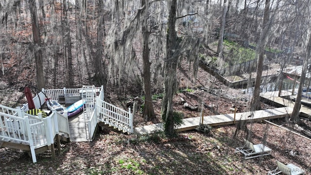 view of yard featuring stairs and a deck