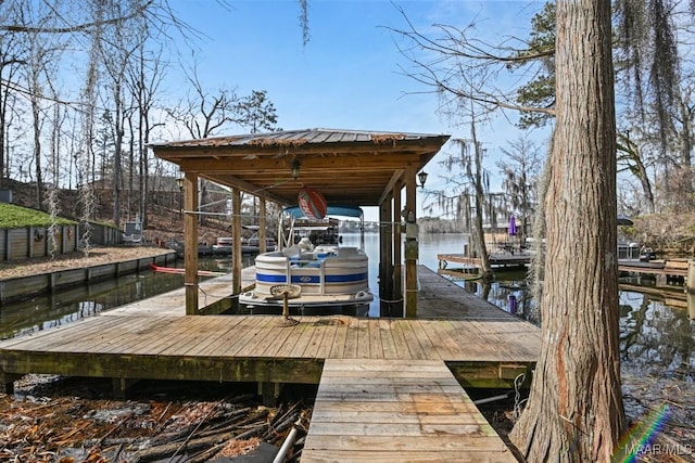 view of dock featuring a water view and boat lift