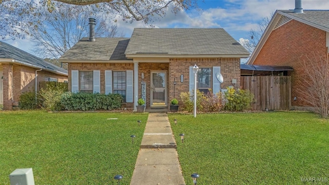 bungalow-style home with a front lawn