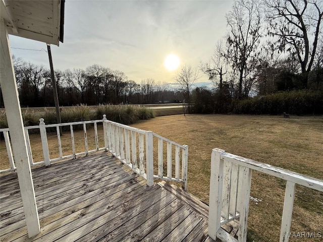 deck at dusk with a yard