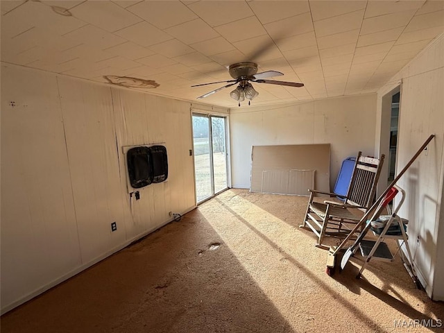 interior space featuring heating unit and ceiling fan