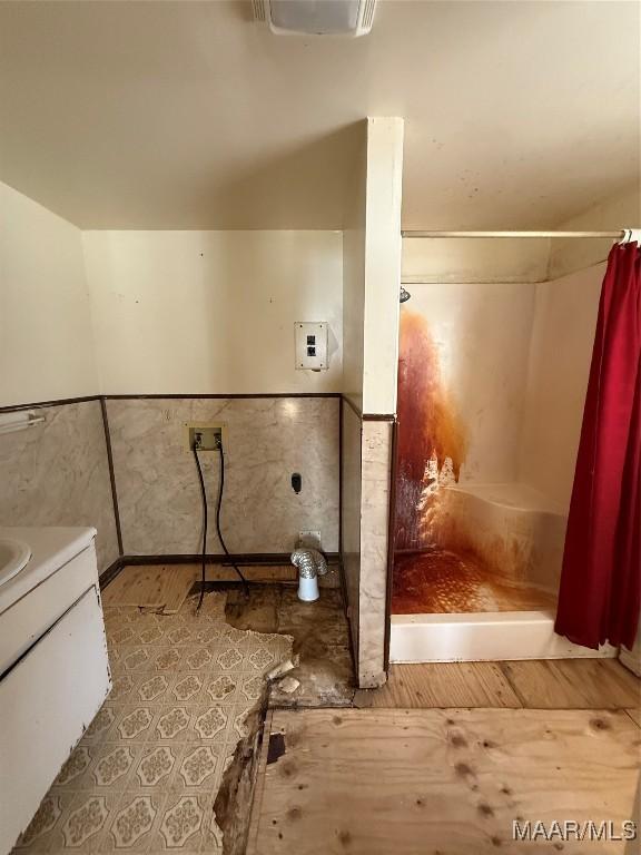 bathroom with vanity and curtained shower