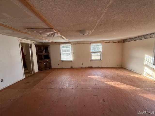 spare room featuring a textured ceiling