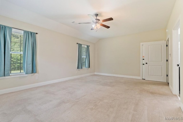 unfurnished room with light carpet, baseboards, and a ceiling fan