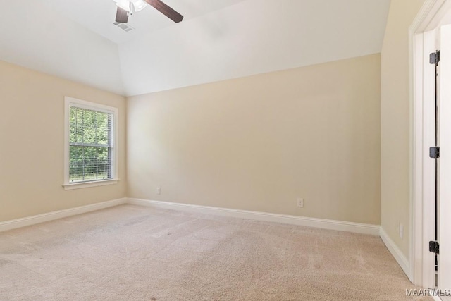 spare room with light carpet, lofted ceiling, and ceiling fan