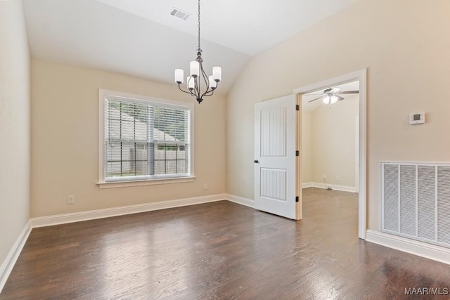 spare room with dark wood-type flooring, visible vents, baseboards, and vaulted ceiling