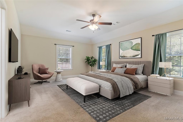 bedroom featuring light carpet, visible vents, and baseboards