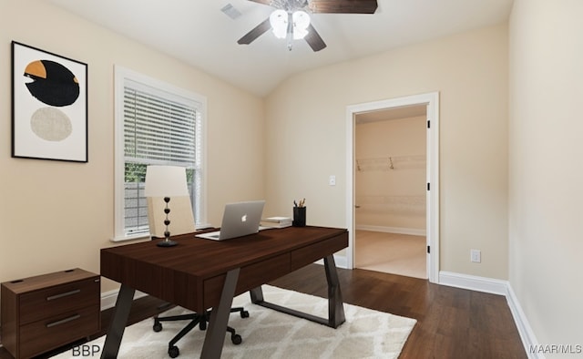 office space with dark wood finished floors, visible vents, baseboards, and ceiling fan