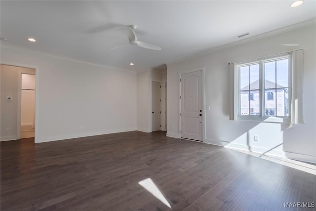 interior space with crown molding, ceiling fan, and dark hardwood / wood-style floors